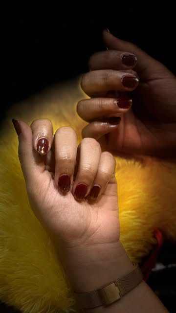 Deep ruby manicure detail